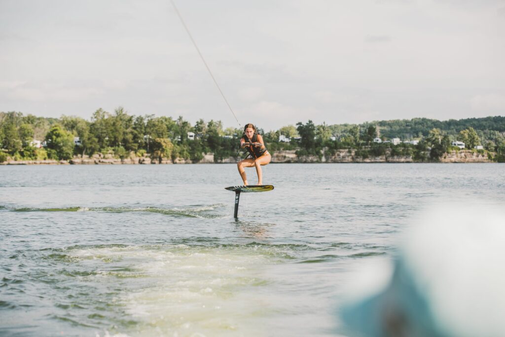 Girl learning how to wake foil at her favorite lake!