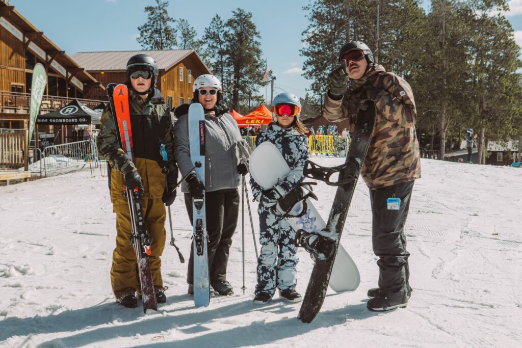 Family enjoying the slopes using a junior seasonal lease from Sun & Ski Sports!