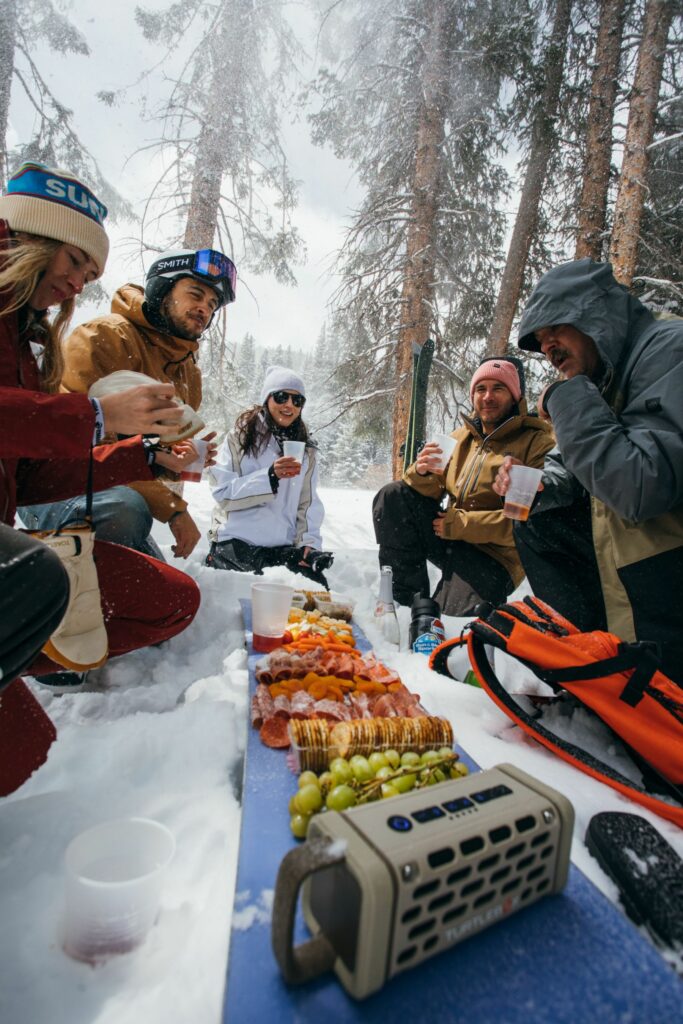 Ingredients for a charcuterski board: meat, cheese, fruits, a Turtlebox speaker, friends, & good vibes!