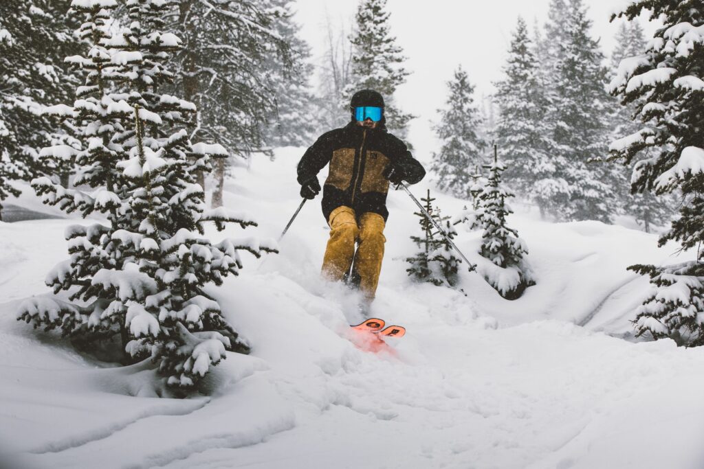 Outdoor Expert skiing powder at Winter Park Resort in Colorado.